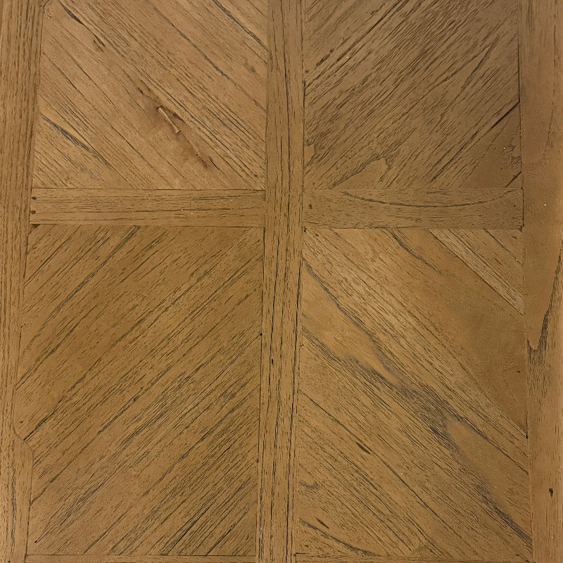 Close-up of wooden panel with herringbone pattern